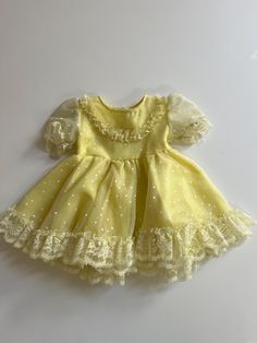 Such a sweet pastel yellow dress! Plenty of party flounce! Lace trim hem and little white print all over. Short puff sleeves. Lace near neckline. By Popaye's, made in USA, tagged XL, looks best for 24 months, 2T. Yellow Toddler Dress, Pastel Yellow Dress, White Hearts, Outfit Design, Pageant Dresses, Pastel Yellow, Character Outfits, Toddler Dress, Full Skirt