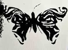 a black and white drawing of a butterfly