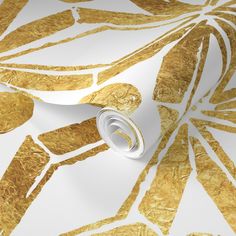 an artistic gold and white wallpaper with metallic foil leaves on it's surface