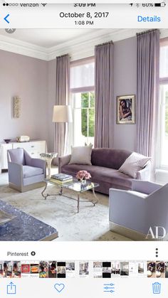 a living room filled with furniture and decor on top of a white floor covered in carpet