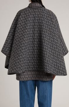 This jacquard cape patterned in Valentino's toile is a supremely cozy wrap knit from virgin wool and cashmere and trimmed with leather binding. 35" length (size 44It) Long sleeves 90% virgin wool, 10% cashmere Dry clean Made in Italy Luxury Wool Cape For Women, Luxury Wool Shawl Cape, Luxury Long Sleeve Wool Cape, Luxury Cashmere Jacquard Knit Outerwear, Cashmere Long Sleeve Jacquard Knit Outerwear, Leather Binding, Cashmere Cape, Cozy Wrap, Cape Pattern