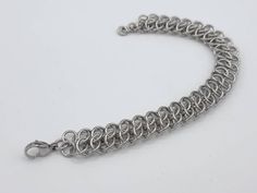 This GSG weave chainmail bracelet is made out of 18guage stainless steel rings, and finished with a stainless steel lobster clasp.  Each ring was individually hand woven to make this stunning bracelet.  This weave goes great with many outfits, and is suitable for both men and women.  Stainless steel does not tarnish or rust, and can be easily cleaned with soap and water.    The length you choose will include the clasp. The bracelet is 1/2inch wide, and 1/4inch thick. Sizing: If you do not know y Chainmaille Ring, Honeycomb Jewelry, Chainmail Bracelet, Chainmail Jewelry, Woven Bracelets, Unique Bracelets, Stretchy Bracelets, Stainless Steel Rings, Steel Ring