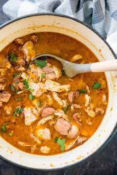 a bowl of soup with meat and vegetables