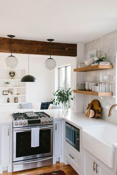 a kitchen with an oven, dishwasher, and stove top in it's center