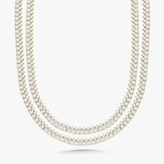 Experience the exquisite beauty of our Capriana Double Row 30 inch Tennis Necklace. Adorned with 35.56 ctw of natural diamonds, this double wrap tennis necklace exudes effortless elegance and sophistication. Metal: 18k White Gold / 18k Yellow Gold / 18k Rose Gold (available upon request) 464 Round Brilliant Cut Natural Diamonds: Approx. 35.56 ctw G Color and SI1-2 Clarity Diamonds Length: 30 inches Can we wrapped around the neck twice for a layered look (as seen in photos) Closure: Box Clasp Looking for a different length? Please email us. Luxury White Diamond Cut Tennis Necklace, Luxury Single Strand Tennis Necklace, White Single Strand Luxury Tennis Necklace, Luxury White Tennis Necklace For Everyday, College Rings, Mens Engagement, Box Clasp, Bridal Bands, Tennis Necklace