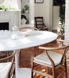 a white table and chairs in a room