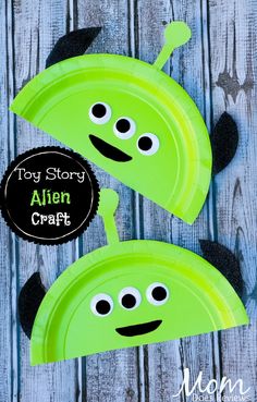 two green paper plates with googly eyes on them and the words, toy story alien craft