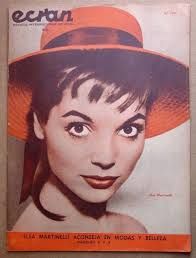 an old magazine with a woman wearing a red hat on it's front cover