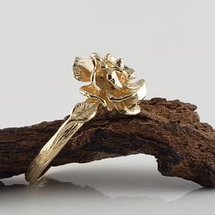 Made to Order Beautiful Hand Sculpted Rose Ring cast in solid Gold with two small leaves on each side. Available in Sterling Silver, 14k or 18k Gold in Yellow, White, and Rose Gold (Silver $150, message for customer purchase link) Size: Rose is 14.23mm wide Band width is 2.66mm ● Gold rings will come a black velvet ring box. ● Silver Rings will come in a mesh tote and gift box. dvjewelrydesigns.com Dawn Vertrees Jewelry...Elegance Uncut. #168 Gold Flower Ring With Rose Design, Gold Rose Design Flower Ring, Gold Flower Ring With Rose Design For Wedding, Wedding Gold Flower Ring With Rose Design, Rose Design Flower Ring For Anniversary, Flower Shaped Rose Ring For Anniversary, Yellow Gold Flower Ring With Rose Design For Wedding, Rose Engagement Ring Flower, Engagement Ring Flower