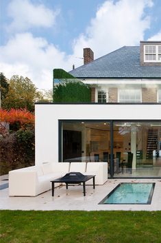 a modern house with a pool in the yard