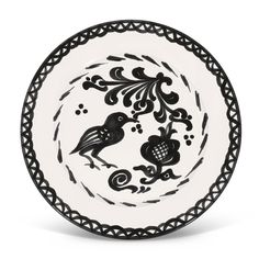 a black and white plate with two birds in the center, on a white background