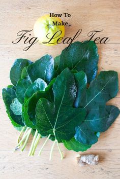 some green leafy vegetables sitting on top of a wooden table next to an apple