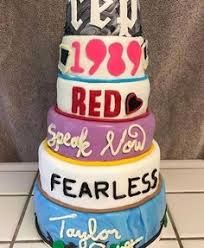 a stack of colorful cakes sitting on top of a counter