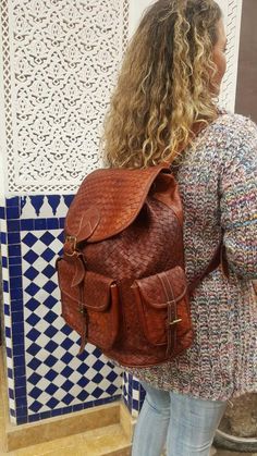 Cognac Backpack With Adjustable Strap, Cognac Backpack With Adjustable Strap For Travel, Cognac Leather Travel Backpack, Brown Backpack With Pockets For Everyday Use, Brown Backpack With Pockets, Brown Backpack For Trips, Brown Vintage Backpack For Trips, Vintage Brown Backpack For Trip, Brown Rectangular Leather Backpack With Pockets