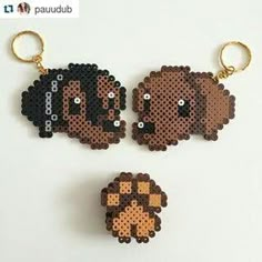 two keychains made out of perler beads, one with a dog on it