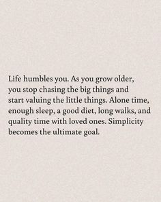 a quote on the side of a white wall that says life rumbles you as you grow older, you stop chasing the big things and start