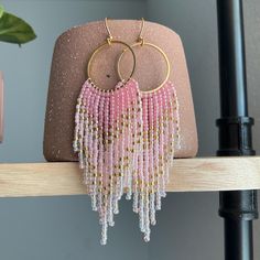 Pink and Gold Ombre Beaded Fringe Earrings | Handmade Beaded Earrings | Hand Crafted Boho Earrings | Statement Jewelry | Unique Gift for Her Welcome to our exquisite collection of handmade beaded earrings that will elevate your style to new heights. Each pair is meticulously crafted with love and attention to detail, resulting in stunning accessories that are perfect for any occasion. Product Details: Length: 4 inches Material: High-quality glass seed beads, Gold plated ear wires and circular ri Pink Beaded Chain Dangle Earrings, Pink Beaded Earrings With Gold Beads As Gift, Pink Round Beaded Earrings With Dangling Beads, Pink Earrings With Gold Beads, Gift Gold Beaded Earrings, Beaded Chain Earrings As Gift, Gift Beaded Earrings With Round Beads, Beaded Chain Earrings With Round Beads For Gifts, Festival Earrings With Round Beaded Chain