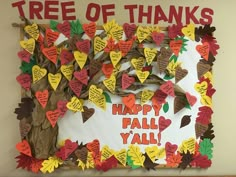 a bulletin board that has been decorated with hearts and leaves on it, which reads tree of thinks happy fall y'all