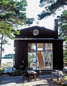 there is a small cabin with stairs to the roof