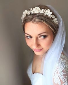 This luxurious bridal tiara is made from cold porcelain clay and will become the best choice of accessories to compliment your bridal look. Its main features are ivory white flowers that are made in different sizes. In the middle of each flower, there is ivory white glass pearl or few pearls. This handmade headband is created with love and care. The best porcelain tiara for your special day! It will look amazing in any hairstyle. A perfect gift for a bride-to-be and for a loved woman! Matching I Silver Tiara, Wedding Earrings Drop, Bridal Flower Crown, Pearl Earrings Wedding, Bridal Earrings Pearl, Handmade Headbands, Porcelain Clay, Ivory White, Pearl Wedding