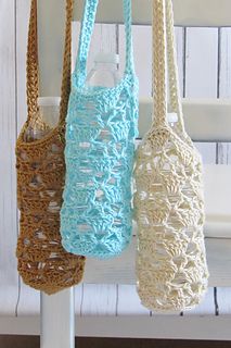 three crocheted purses hanging from a hook