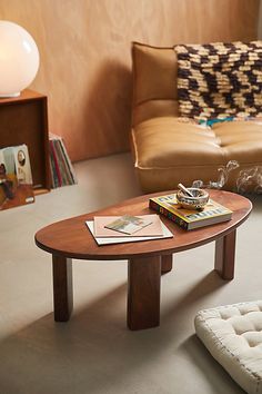 Create a contemporary gallery in your space with our Organic Shaped Coffee Table. Crafted from mango wood, this coffee table features a puddle-shaped tabletop with sleek block legs. Made from natural materials, each coffee table is one-of-a-kind with a unique finish that has natural variance from piece to piece. Available exclusively at Urban Outfitters. Features Organic Shaped Coffee Table from UO Home Crafted from mango wood with statement finishes Puddle-shaped tabletop & block legs One-of-a-kind, each coffee table has natural wood variance Some assembly required UO exclusive Content + Care Assembly required - Assembly instructions and hardware included Mango wood Wipe clean Please note, this is a solid wood item may naturally expand and contract with seasonal changes in humidity. Impor Coffee Table Urban Outfitters, Room Wall Decoration Ideas, Organic Coffee Table, Living Room Wall Decoration, Modern Living Room Wall, Wall Decoration Ideas, Room Wall Decoration, Uo Home, Unique Coffee Table