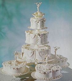 a white wedding cake sitting on top of a table