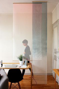 a person sitting at a desk with a laptop