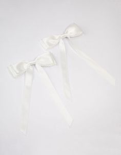 Style the coquette trend with this set of white hair bows. This hair accessory pack includes two individual ribbons, designed with a white satin fabric and alligator clip on the back. Dimensions: Length 23mm x Width 13mm Fabric | Lovisa White Fabric Satin Scallop Hair Bow Pack White Satin Fabric, White Hair Bows, Accessories Packing, White Satin, White Fabric, White Hair, White Fabrics, Hair Accessory, Hair Bow