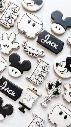 mickey and minnie mouse cookies are arranged on a white table with the words i love you