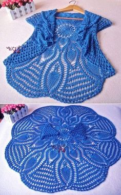 crocheted doily is shown in blue and white, with pink flowers behind it