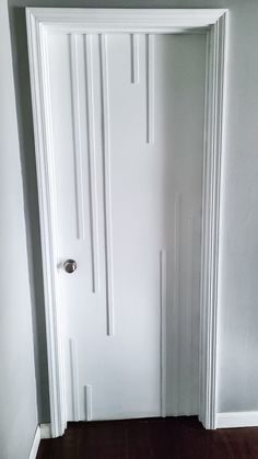 an open white door in a room