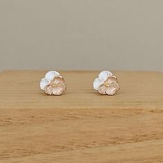 These gorgeous sterling silver, gold and rose gold plated Violet flower stud earrings are truly special, and will complement any outfit whatever the occasion. Your earrings will be placed in one of our lovely Nest embossed gift boxes. Our free gift wrap includes a grey gift bag, and a gift tag. If you include a gift message with your order, we will handwrite it onto the gift tag for you. Made from: Sterling silver and 18ct gold and rose gold plate Dimensions: Diameter approx. 7mm Flower Stud Earrings, Violet Flower, Flower Stud, Star Gift, Personalized Bracelets, Letter Charms, Flower Earrings Studs, Flower Studs, Sterling Earrings