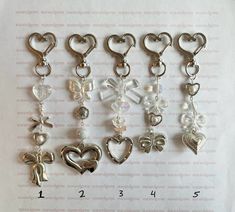 the charms are all different shapes and sizes, but one has a bow on it