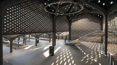 the inside of an empty building with lots of light coming in from the ceiling and windows