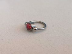 "This piercing jewelry is daith or septum ring in a combination of two types of jewelry. Horseshoe and captive bead. You can wear it only as a silver horseshoe that is easy to hide inside of your nose. Size of the gap between screw beads is 5mm which makes it comfortable to wear hidden inside the nose. It is ideal for people who want to hide their septum piercing on some occasions. When you decide to show your piercing, it is simple to put captive bead in horseshoe ring. Specifications: 16 gauge Gift Internally Threaded Hoop Belly Rings, Gift Metal Septum Ring Internally Threaded, Captive Bead Ring, Daith Earring, Ear Lobe Piercings, Circular Barbell, Horseshoe Ring, Daith Earrings, Conch Earring