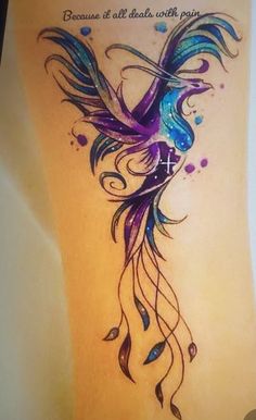 a colorful tattoo with a bird on it