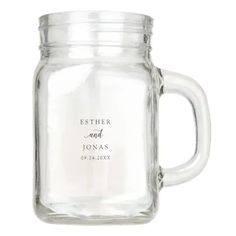 a glass mason jar with the words aspen and blake printed on it's side