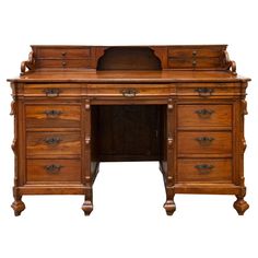 an old fashioned wooden desk with drawers