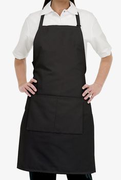 a woman standing with her hands on her hips wearing an apron and smiling at the camera