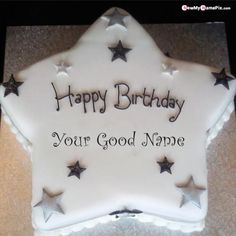 a birthday cake that is shaped like a star with the words happy birthday mishele written on it