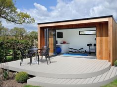 an outdoor living area with stairs leading up to it