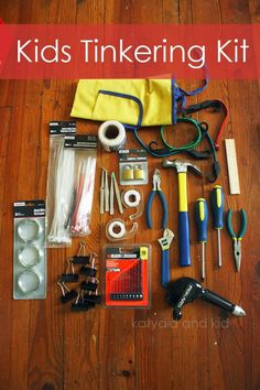 the contents of a kids'tinkering kit laid out on a wooden floor