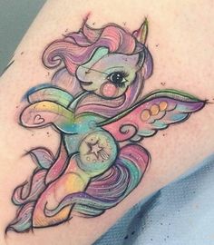 a tattoo with an image of a unicorn on it