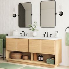 a bathroom with two sinks and mirrors on the wall