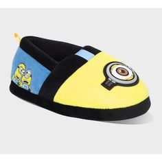 Step into comfort and fun with Minions: The Rise of Gru Toddler Big Face Scuff Slippers in Yellow. These cozy slippers feature your favorite Minion characters, bringing a playful touch to your loungewear. Made from lightweight material makes them perfect for relaxing at home. Ideal for Minion fans of all ages, these slippers combine comfort, style, and a bit of childhood magic in every step. Gru And Minions, Minions The Rise Of Gru, Minions Fans, Minion Characters, Rise Of Gru, Toddler Slippers, Cozy Slippers, Kids Slippers, Big Face