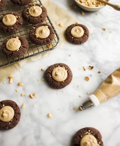 Inside-Out Peanut Butter Blossoms by Kate Wood of Wood and Spoon. These are chewy chocolate thumbprint cookies filled with a peanut butter cup filling. These cookies are the perfect Christmas cookie to make for the peanut butter lovers in your life this holiday season. Learn how and read about the recipe on thewoodandspoon.com Christmas Cookie Swap, Butter Blossoms, Sprinkle Cookies, Peanut Butter Cup