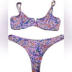 B Swim Aruba Top In Beachfront Bloom Print. Size Medium. Stock Photo To Show Style And Color And Fit. Last Few Personal Gallery Pics Are Of Actually Swim Suit. This Bombshell Bra Will Flatter Any Shape And Provide Just The Right Amount Of Support. Adjustable Straps And Underwire Make The Aruba Top Just As Comfortable As It Is Cute And Classy. Underwire Adjustable Straps Hook Closure At Back Bottom Is The Havana Bottom. Also Medium. Color Is Beachfront Bloom. Pics To Show Style And Fit. The Havan Purple Swimwear For Sunbathing During Beach Season, Purple Beachwear Swimwear For Poolside, Lavender Swimwear For Spring Pool Time, Lavender Triangle Top Swimwear For Summer, Summer Lavender Swimwear For Swimming, Fitted Purple Swimwear For Vacation, Purple Beachwear For Poolside, Beachy Purple Swimwear With Triangle Top, Purple Swimwear For Summer Pool Occasions