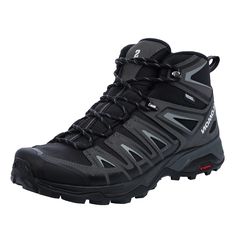 a pair of black hiking shoes on a white background