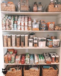 a pantry filled with lots of food and containers on top of white shelving units